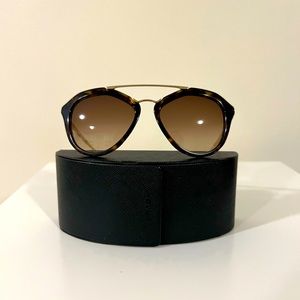 Authentic Prada sunglasses with gold bar.